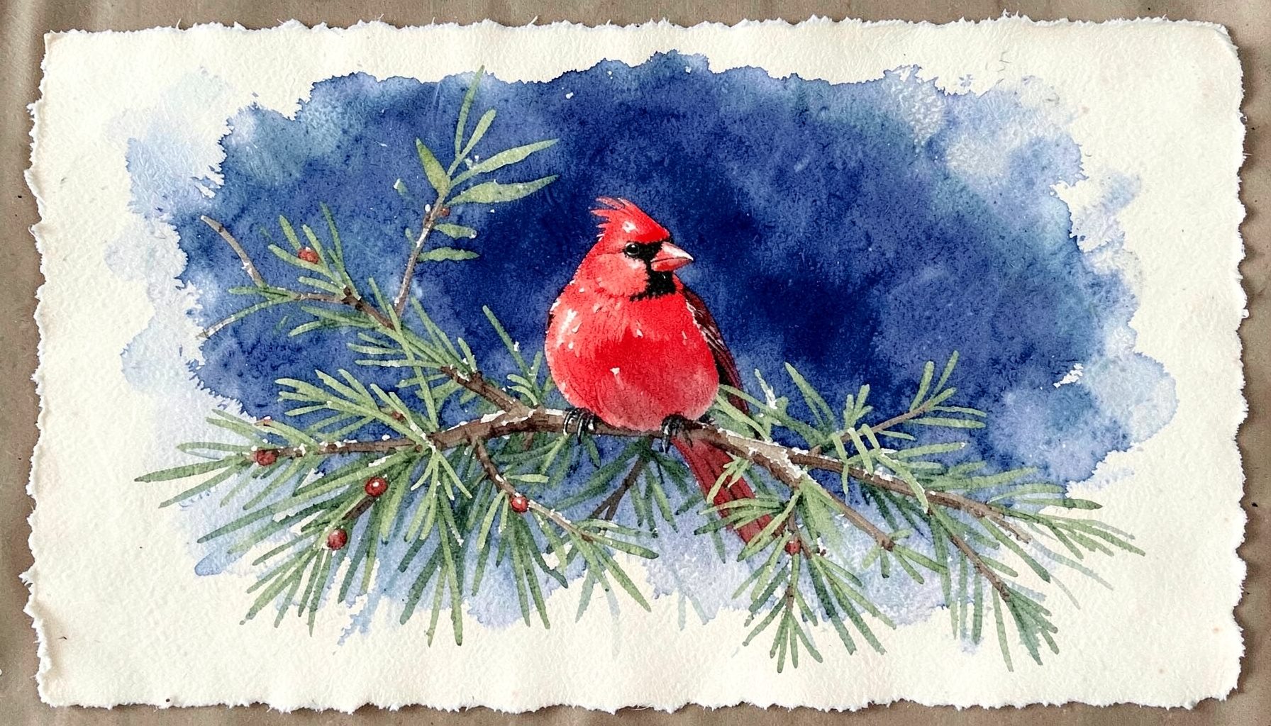 A Cardinal in Pine rug showing a bright red cardinal perched among evergreen branches on a cream field