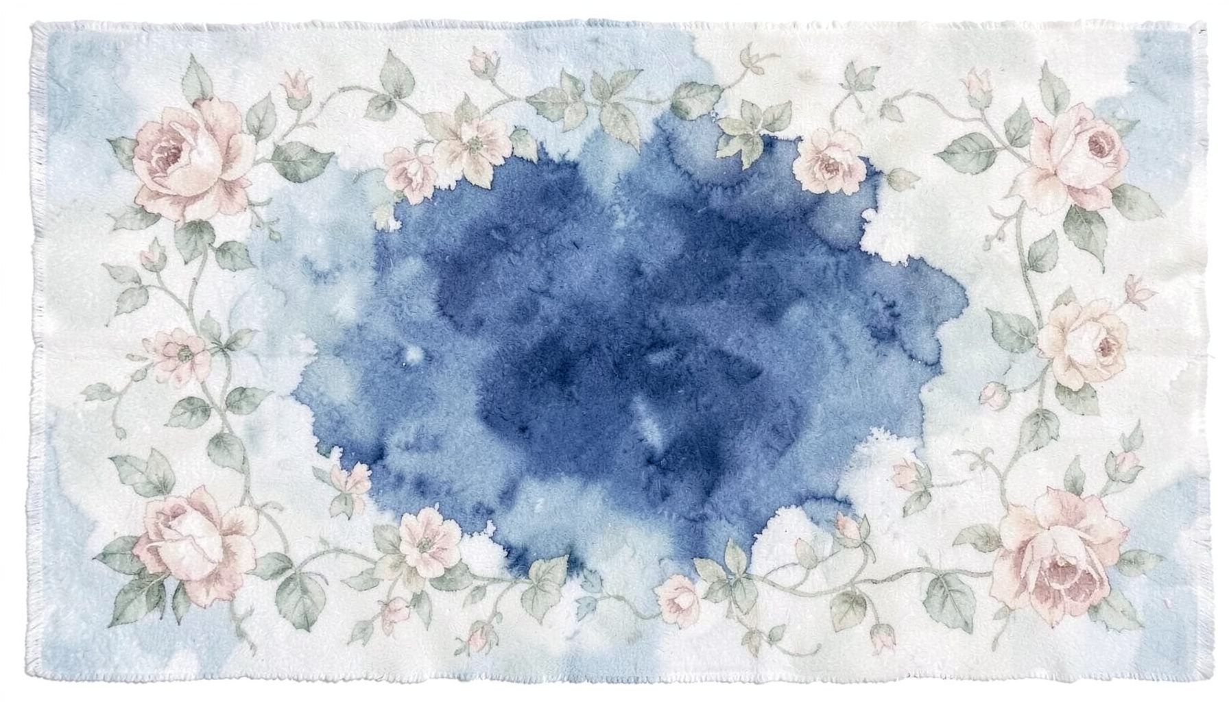 A soft cotton floral rug with delicate rose and ivy patterns in muted sage and blush hues